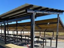 A photo of the 100 yard range under construction with blue sky.