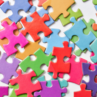 Colorful puzzle pieces on a white background
