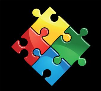 Pieces of puzzle game in yellow, green, blue and red