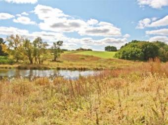 A scened of fields and body of water in Scott County