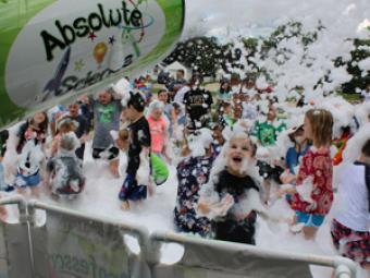 Photo of children playing in foam