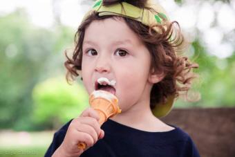 photo of child eating an ice cream cone