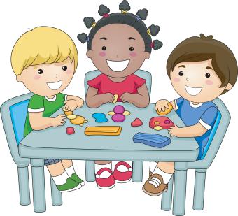 Group of Children at a Table Playing With Clay