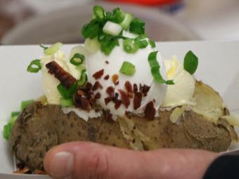 Baked potato loaded with toppings.